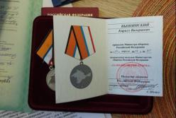 Российский агент хранил в Киеве в своем офисе награды Путина