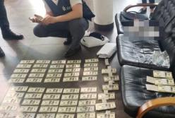 В Киеве задержан прокурор на взятке в $100 тысяч (фото)