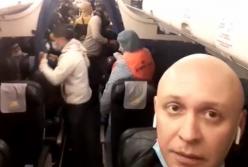 "Пассажиры пили жаропонижающее": активист в прямом эфире показал, как в Киеве проверяют самолет из Италии (видео)