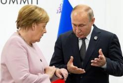 Путин и Меркель обсудили "необходимость закрепления особого статуса Донбасса"