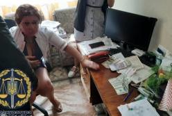 В Харькове за взятку задержали главу военной медкомиссии (фото)