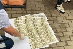 В Никополе задержали полицейского на крупной взятке (фото)