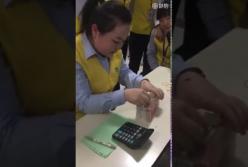 550 купюр за 77 секунд: кассир из Китая считает деньги (видео)