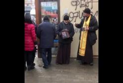 В Мелитополе мужчины притворялись священниками и просили деньги у прохожих (видео)