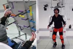 Парализованный человек научился управлять экзоскелетом силой мысли (видео)