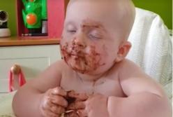 Малыш уснул, поедая шоколад (смешное видео)